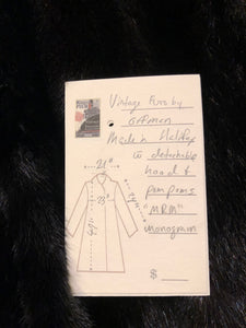 Kingspier Vintage - Vintage Furs by Offerman long fur coat with fur pom poms and a removable hood, hook and eye closures, pockets and an “M.R.M” monogram on the black satin lining.

Made in Nova Scotia, Canada.