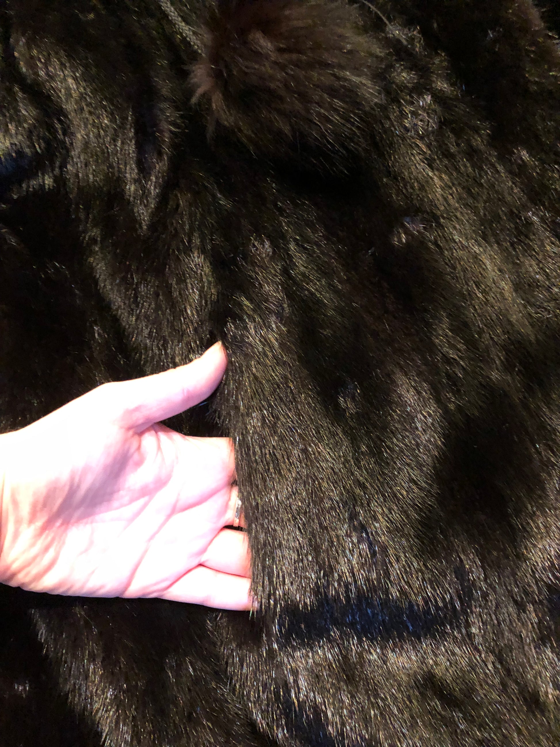 Kingspier Vintage - Vintage Furs by Offerman long fur coat with fur pom poms and a removable hood, hook and eye closures, pockets and an “M.R.M” monogram on the black satin lining.

Made in Nova Scotia, Canada.