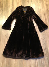 Load image into Gallery viewer, Kingspier Vintage - Vintage House of Apple long fur coat with flared sleeves, hook and eye closures, two front pockets and a “L.C.J.” monogram in the satin lining.
