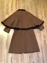 Load image into Gallery viewer, Kingspier Vintage - Vintage “Ch” Part three Parienne by Tokyo and Co long coat with fur trim cape, button closures and two front flap pockets.

Fibres unknown.
Size 7.
