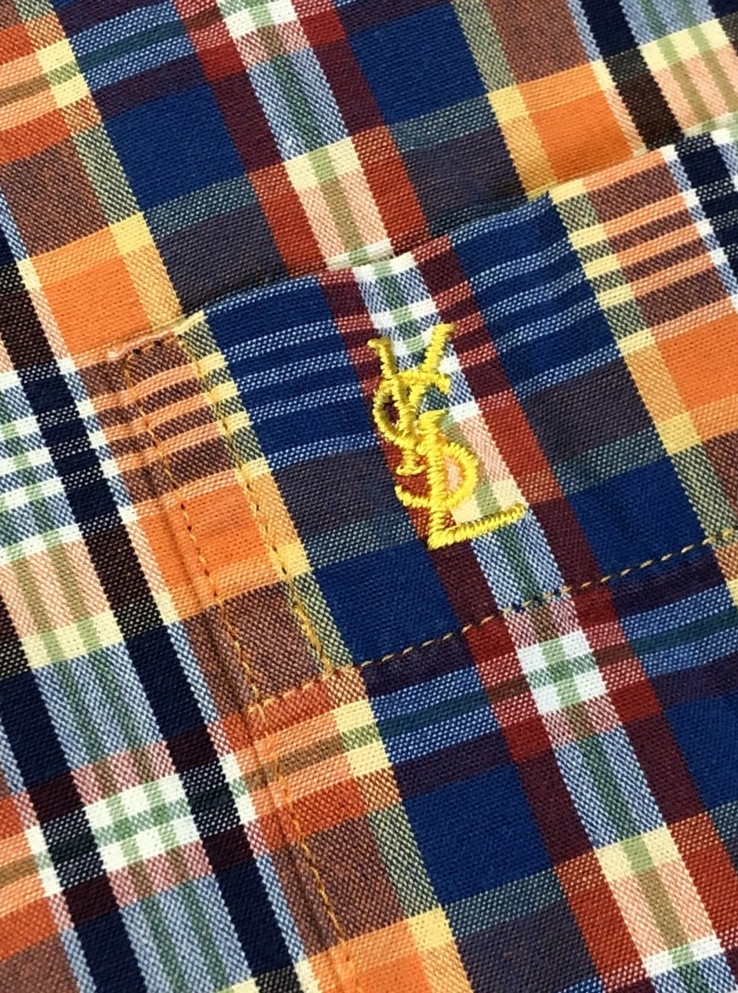 Kingspier Vintage - Yves St Laurent blue, orange yellow, green, white and red plaid button up shirt. 100% cotton with a small YSL logo on the chest. Size large mens.
