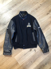Load image into Gallery viewer, Kingspier Vintage - Dartmouth Whalers navy blue wool blend with leather trim varsity jacket. Jacket features Dartmouth whalers emblem on the chest and the back, “defence” embroidered on the left sleeve and “Forbes” embroidered on the right sleeve, insulated lining, two inside pockets, two slash pockets, zipper and snap closures. Made by Canada sportswear. Size small.

