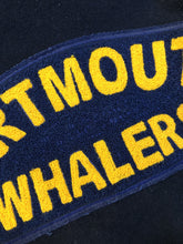 Load image into Gallery viewer, Kingspier Vintage - Dartmouth Whalers navy blue wool blend with leather trim varsity jacket. Jacket features Dartmouth whalers emblem on the chest and the back, “defence” embroidered on the left sleeve and “Forbes” embroidered on the right sleeve, insulated lining, two inside pockets, two slash pockets, zipper and snap closures. Made by Canada sportswear. Size small.

