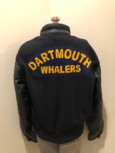 Kingspier Vintage - Dartmouth Whalers navy blue wool blend with leather trim varsity jacket. Jacket features Dartmouth whalers emblem on the chest and the back, “defence” embroidered on the left sleeve and “Forbes” embroidered on the right sleeve, insulated lining, two inside pockets, two slash pockets, zipper and snap closures. Made by Canada sportswear. Size small.
