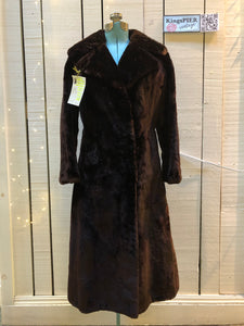 Kingspier Vintage - Vintage House of Appel long fur coat with flared sleeves, hook and eye closures, two front pockets and a “L.C.J.” monogram in the satin lining.