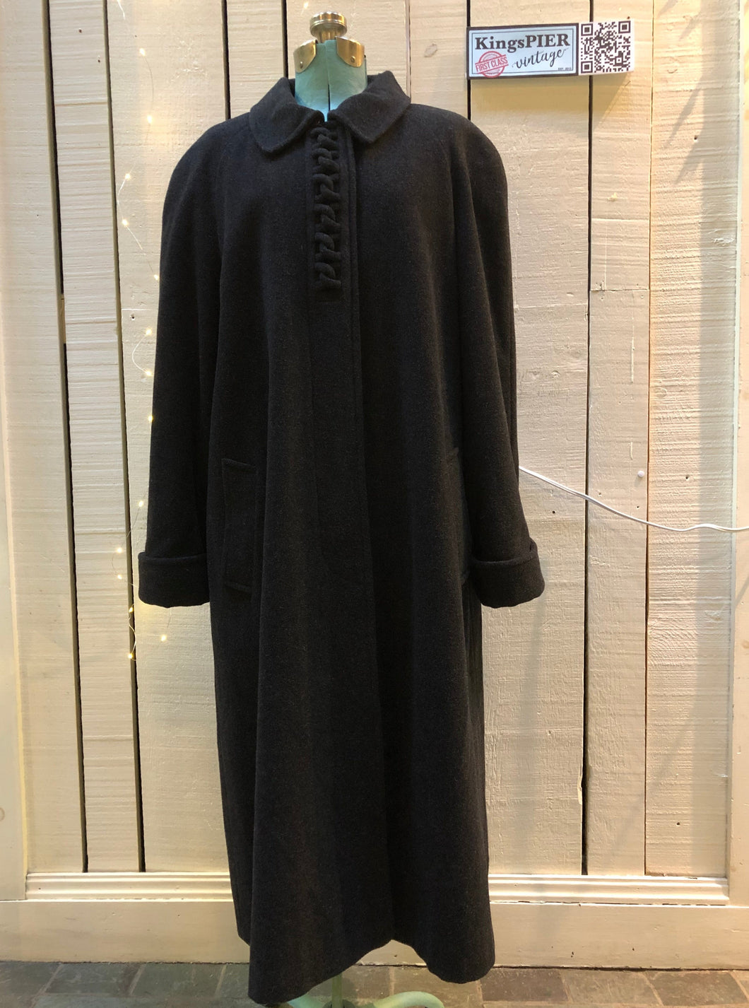 Kingspier Vintage - Vintage Luba limited edition lambswool blend long black coat with woven detail on the front, button closures, two pockets in the front and a satin lining.Made in Romania.Size 16.