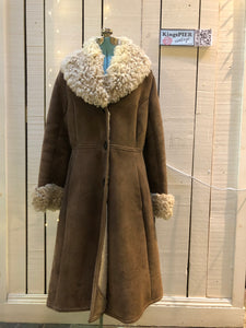 Vintage Antarrex Mongolian lambskin full length shearling coat with button closures and two front pockets.