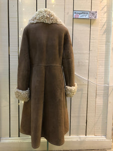 Vintage Antarrex Mongolian lambskin full length shearling coat with button closures and two front pockets.