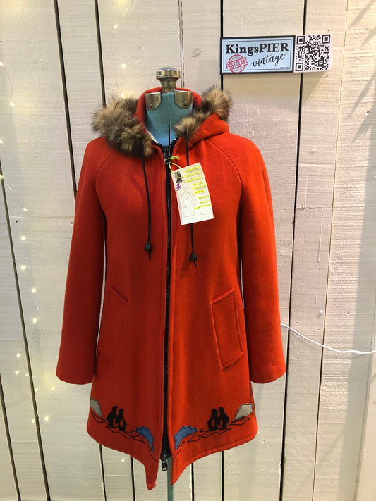 Kingspier Vintage - Vintage James Bay 100% virgin wool northern parka in bright red. This parka features a fur trimmed hood, zipper closure, pockets, quilted lining, storm cuffs, and penguin scene in felt applique. Made in Canada.