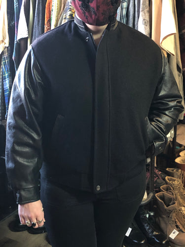 Kingspier Vintage - Concord black leather and wool varsity jacket with zipper and snap closures and slash pockets. Size XS.