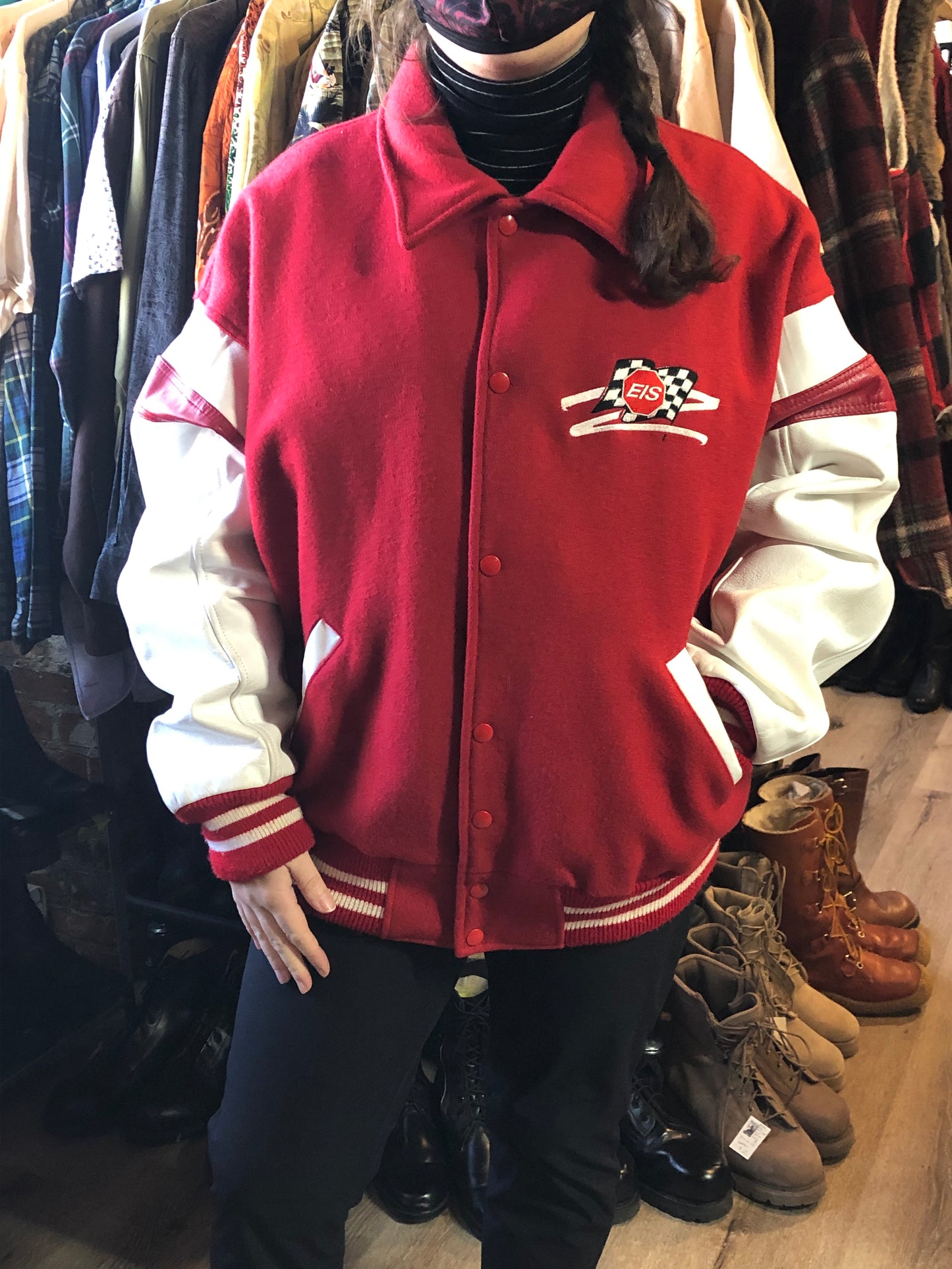 Kingspier Vintage - EIS red letterman’s jacket with white leather arms, race flag embroidered emblem, snap closures and slash pockets. Size large