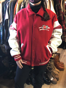 Kingspier Vintage - EIS red letterman’s jacket with white leather arms, race flag embroidered emblem, snap closures and slash pockets. Size large