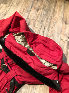 Kingspier Vintage - Vintage Obermeyer red one piece ski suit with suede belt, packable hood, quilted lining, zipper closure and multiple zip pockets.