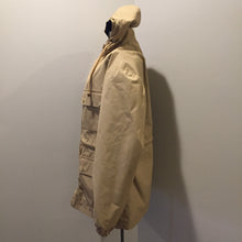 Load image into Gallery viewer, Kingspier Vintage - 1960s Vintage Zero King storm jacket in beige with hood, zipper closure, four flap pockets on the front, drawstring at the waist. Made in USA. Size 44.

