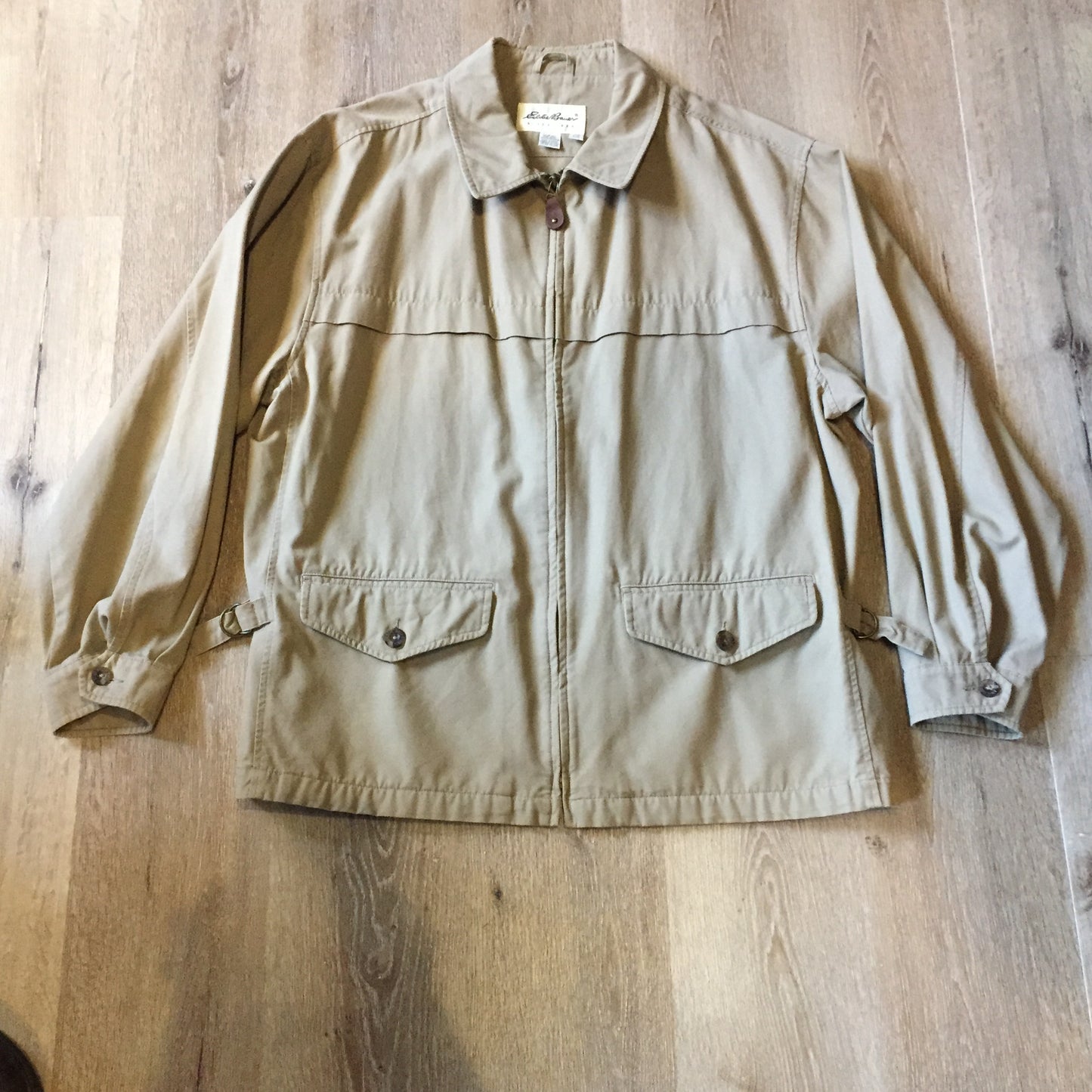 Kingspier Vintage - Eddie Bauer beige 100% cotton chore jacket with zipper closure and two flap pockets. Size large.
