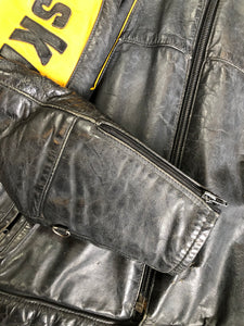 Kingspier Vintage - Bombardier Ski-Doo black and yellow leather jacket by Drospo with knit collar, zipper closure, zip pockets, quilted lining and one inside zip pocket. Made in Canada
