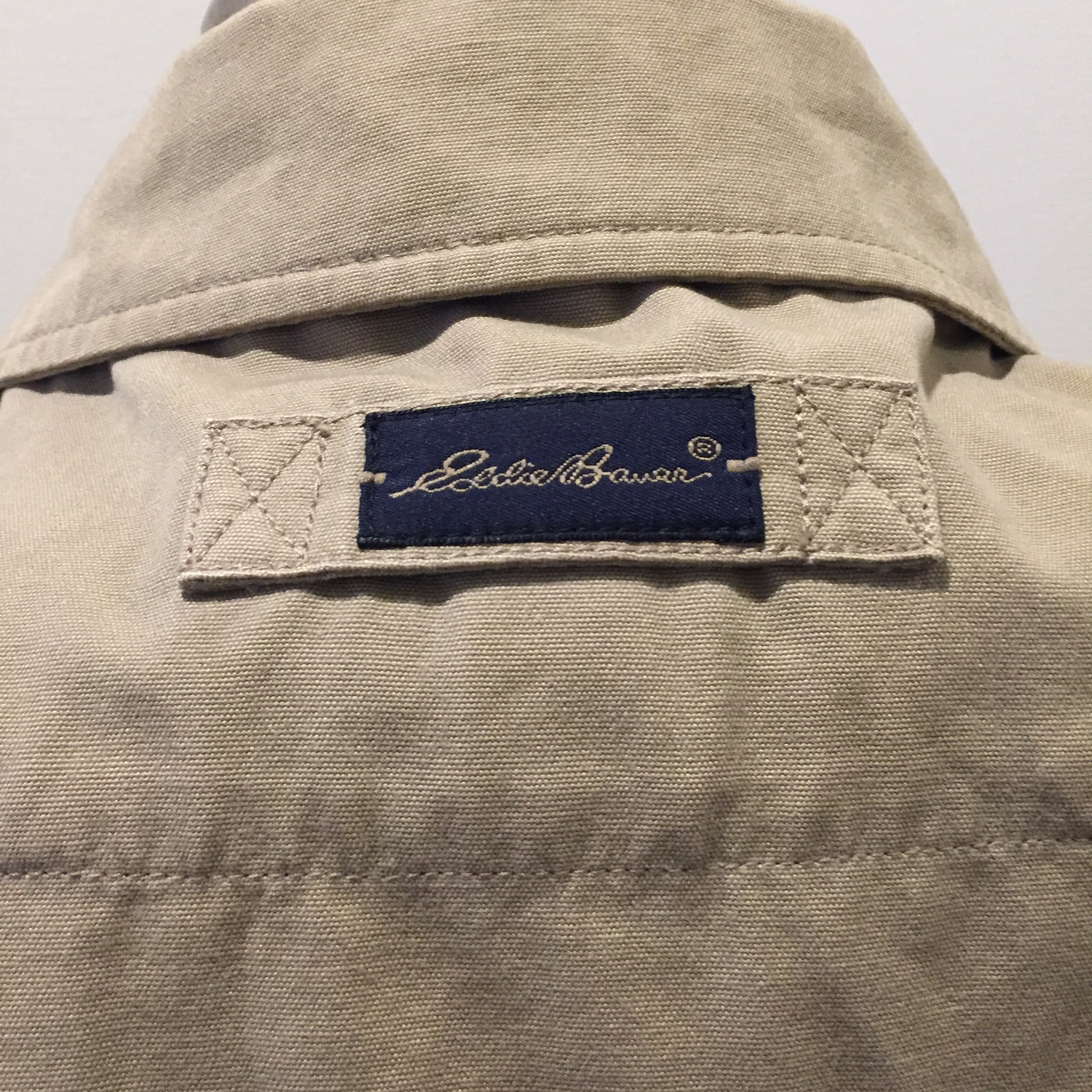 Kingspier Vintage - Eddie Bauer beige 100% cotton chore jacket with zipper closure and two flap pockets. Size large.
