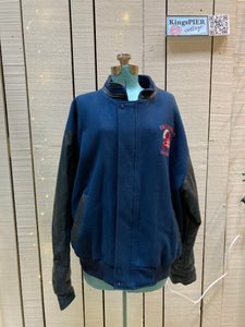 Kingspier Vintage - Vintage Cole Harbour AAA Hockey blue varsity jacket with leather arms, zipper and snap closure, two front pockets and a quilted lining.

Made in Canada.
Size XL.