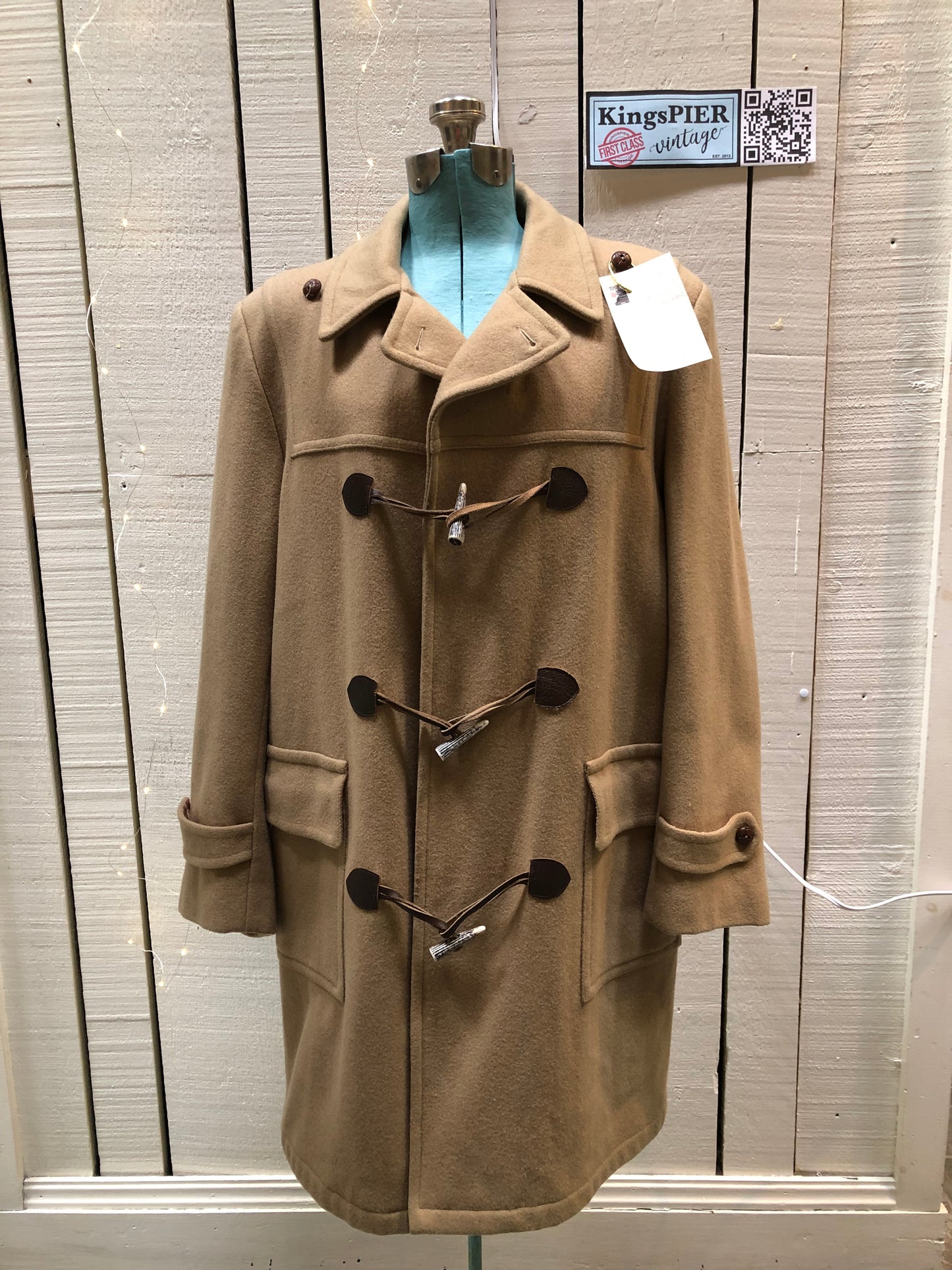 Kingspier Vintage - Wool blend coat (75% wool, 25% other) with fuzzy acetate lining, antler and leather toggle closures and front flap pockets.

Made in Canada.