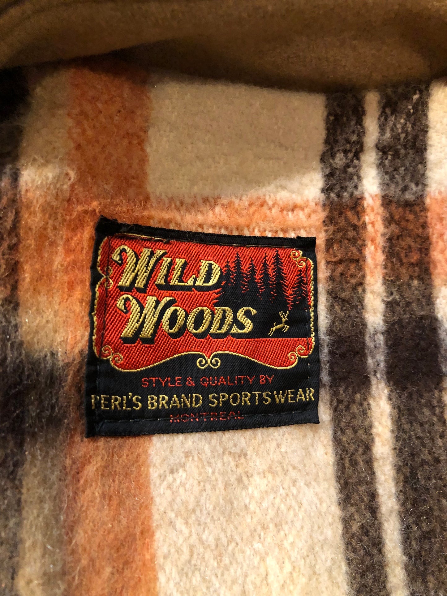 Kingspier Vintage - Wool blend coat (75% wool, 25% other) with fuzzy acetate lining, antler and leather toggle closures and front flap pockets.

Made in Canada.