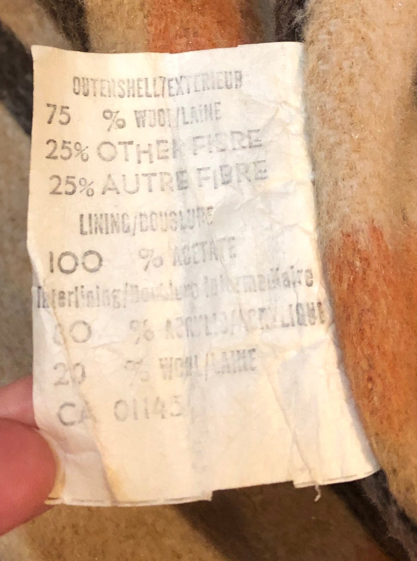 Kingspier Vintage - Wool blend coat (75% wool, 25% other) with fuzzy acetate lining, antler and leather toggle closures and front flap pockets.

Made in Canada.