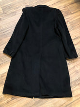 Load image into Gallery viewer, Kingspier Vintage - Vintage Baron Anderson long black coat with button closures and two flap pockets, Fibres unknown.

Made in Britain.
