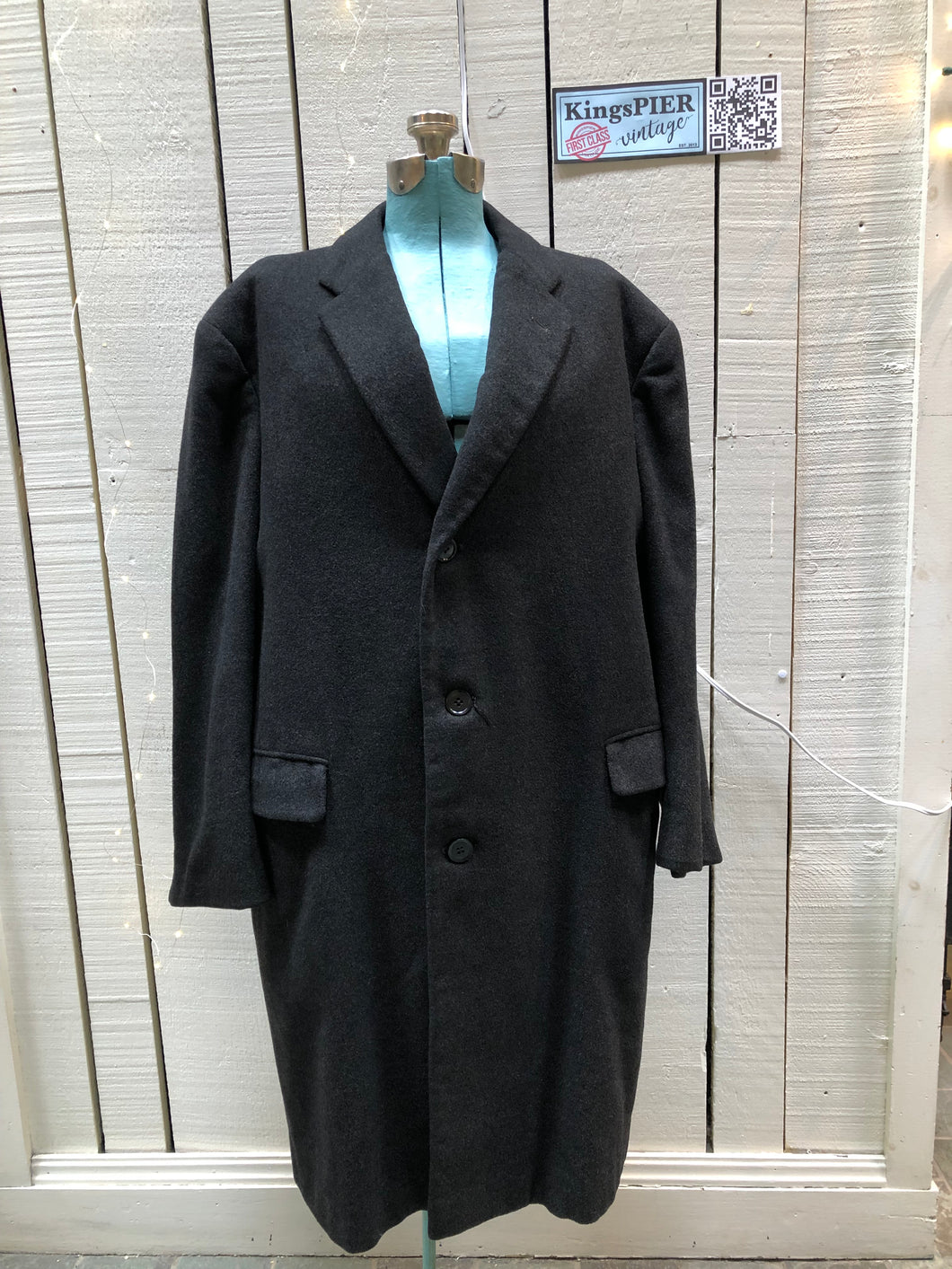 Kingspier Vintage - Vintage 1960s charcoal grey wool overcoat with button closures and flap pockets.