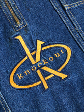 Load image into Gallery viewer, Kingspier Vintage - Vintage Knockout Jeans pullover denim jacket in a medium wash with quarter zip closure, embroidered logo on the front, knit cuffs, slash pockets, one patch pocket on the chest and a leather patch on the back. Size Xl. Made in USA

