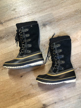 Load image into Gallery viewer, Sorel five eyelet lace up winter storm boots with sheepskin upper, warm recycled polyester blend lining and rubber outsole.

Size 6 US womens

The uppers and soles are in excellent condition.

