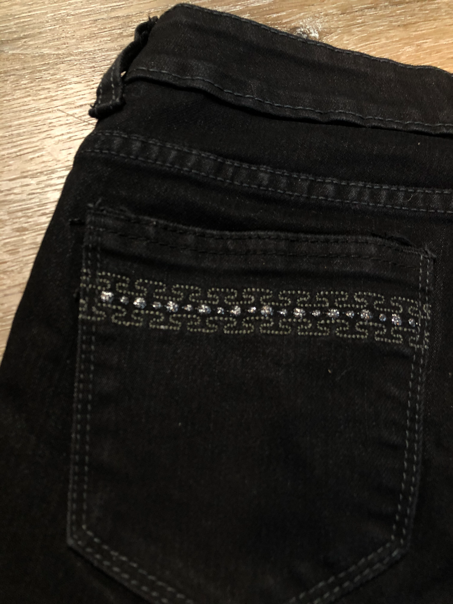 Kingspier Vintage - Versace black denim skinny jeans with metal Versace emblem on the back. Made in Italy. Size 27.