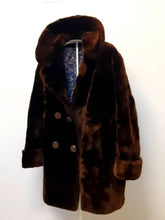 Load image into Gallery viewer, Kingspier Vintage - This phenomenal piece combines the elegance of a fur with the comfort and warmth of luxurious shorn beaver fur. There are two slash pockets, ribbon belt tie inside, and 1 hook clasp in excellent condition
