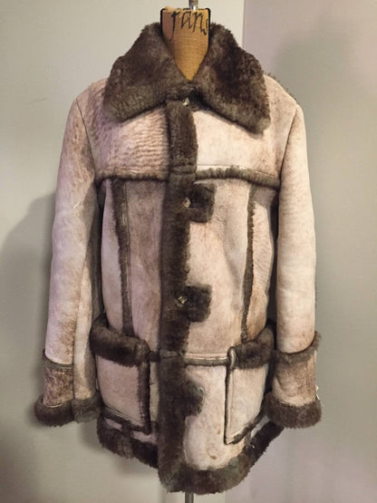 Kingspier Vintage - This robust sheepskin is in remarkable shape. Wool is still as lofty as new. I believe this coat was manufactured in the 60's. Made in Canada.