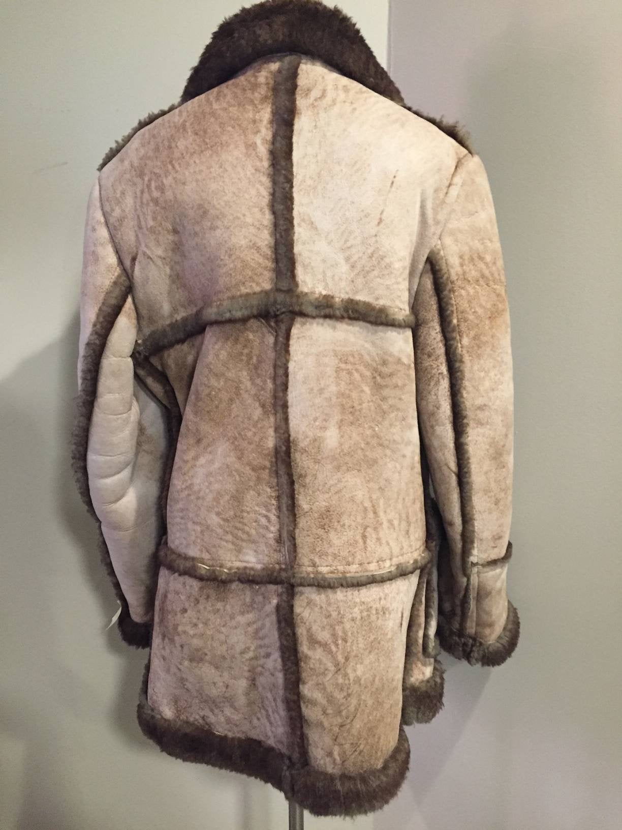 Kingspier Vintage - This robust sheepskin is in remarkable shape. Wool is still as lofty as new. I believe this coat was manufactured in the 60's. Made in Canada.