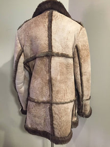 Kingspier Vintage - This robust sheepskin is in remarkable shape. Wool is still as lofty as new. I believe this coat was manufactured in the 60's. Made in Canada.