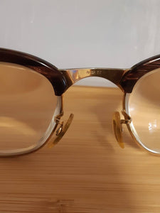 Extremely rare vintage redwood & gold American Optical Sirmont combination eyeglasses made famous by Malcolm X, SOLD