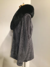 Load image into Gallery viewer, Kingspier Vintage - &lt;p&gt;This unusual mottled grey shearling 3/4 jacket is velvetty and supple. &lt;br&gt; The finish is silky and soft and the satin lining is a dramatic print of stylized wild animal hide designs.&lt;br&gt; The rich black long haired shawl collar lends a sophisticated compliment to the subtle grey palette of the jacket and the fine leather detail trims.&lt;/p&gt;
&lt;p&gt;This piece is in gorgeous as new condition.&lt;/p&gt;
