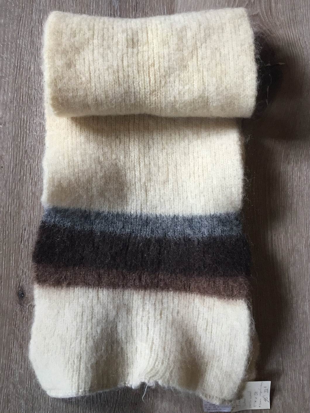 Kingspier Vintage - <p>Very soft vintage cream-coloured Icelandic wool scarf with contrasting stripes in brown and grey. There are minor imperfections on this piece and it is priced accordingly.</p>
