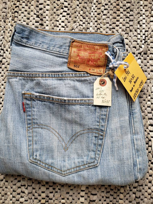 Kingspier Vintage - Classic vintage Levi's 501 button fly., 36"x32", 
Made in Mexico, Very experienced with modest cuff wear, A faint rust stain midway back of right leg is pictured, Waist 36"
Rise 11.75", Inseam 31", Thigh 10.25", Hem width 8.75"