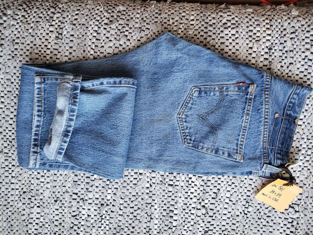 Kingspier Vintage - Classic Levi's 501 button fly., Made in USA. 34"x34", Good condition, Some faint rust staining as pictured on rear right pocket and leg, Gently broken in.