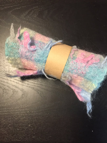 Kingspier Vintage - <p>Multi-coloured handknit mohair scarf featuring shades of blue, pink, and yellow. Almost like cotton candy! Measures 7.5x56 inches.</p>