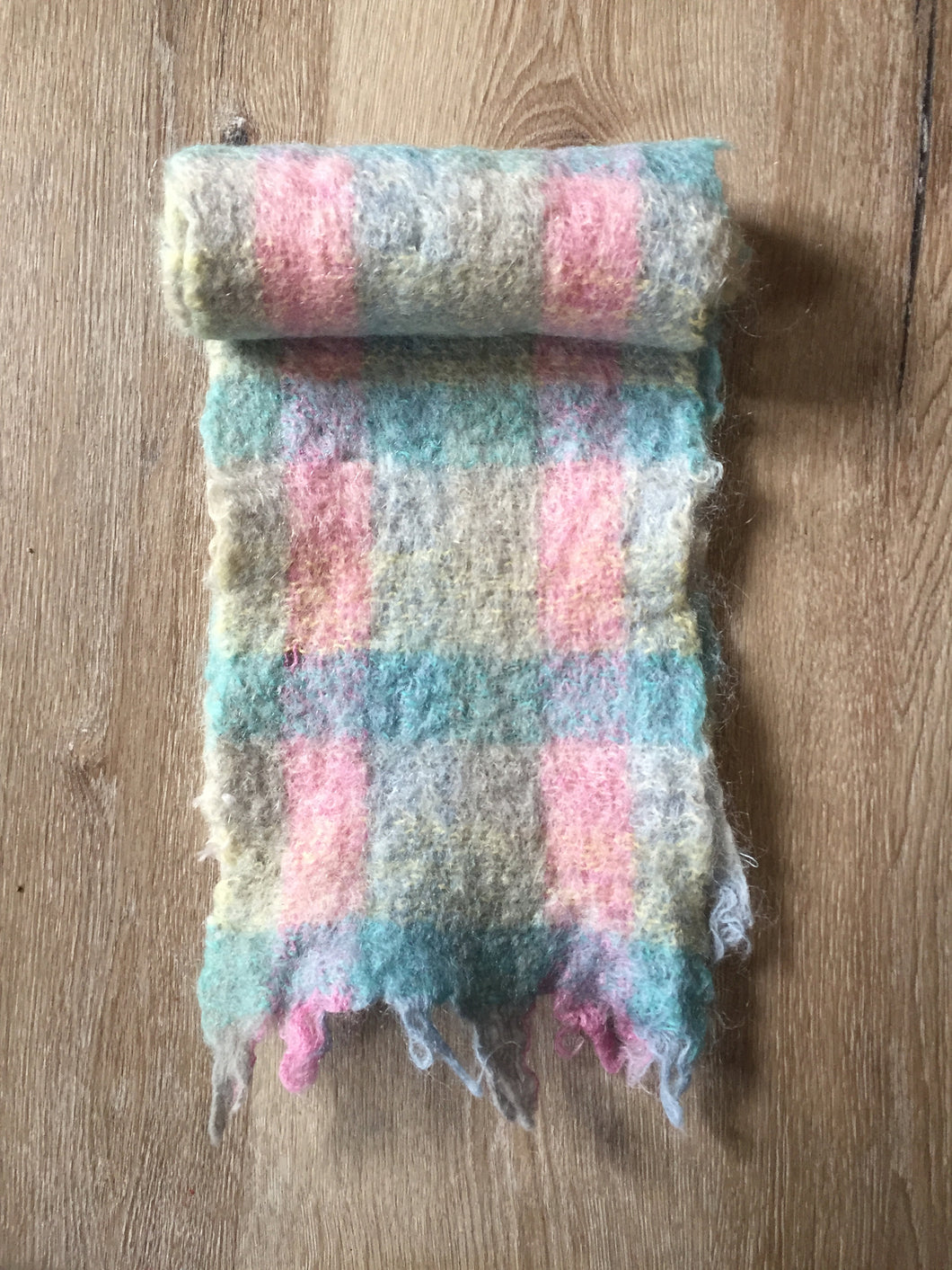 Kingspier Vintage - <p>Multi-coloured handknit mohair scarf featuring shades of blue, pink, and yellow. Almost like cotton candy! Measures 7.5x56 inches.</p>