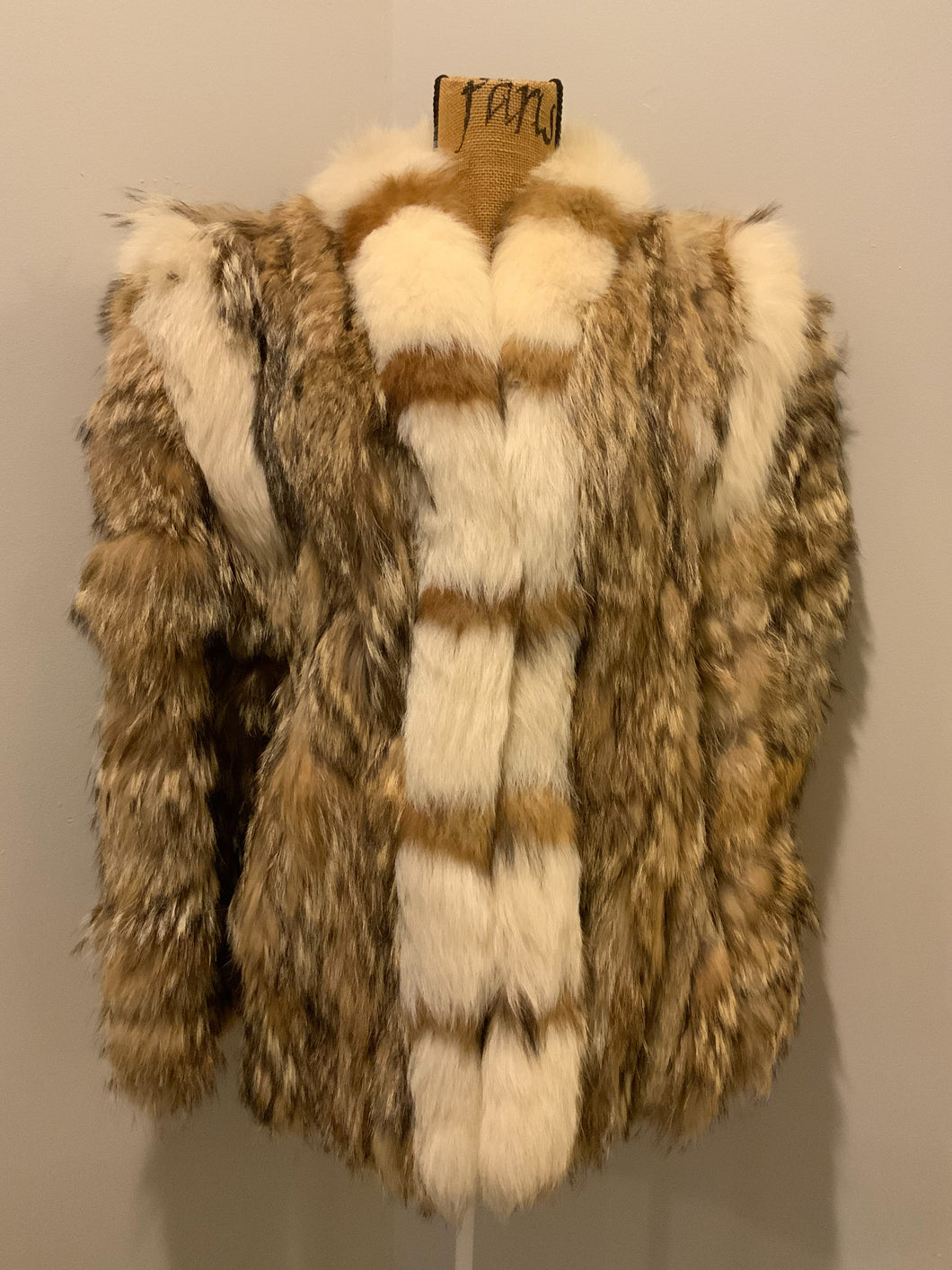 Kingspier Vintage - Light brown with white fur accents (we believe rabbit and fox). 