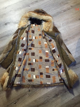 Load image into Gallery viewer, Kingspier Vintage - Vintage Northern Canadian hooded fur and suede coat with fox fur trim. This coat features a beautiful diagonal patterned in the fur accented with suede pieces, snap closures, fun patterned lining and inside pocket.
