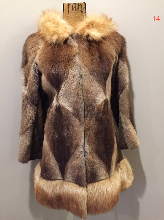 Kingspier Vintage - Vintage Northern Canadian hooded fur and suede coat with fox fur trim. This coat features a beautiful diagonal patterned in the fur accented with suede pieces, snap closures, fun patterned lining and inside pocket.