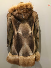 Load image into Gallery viewer, Kingspier Vintage - Vintage Northern Canadian hooded fur and suede coat with fox fur trim. This coat features a beautiful diagonal patterned in the fur accented with suede pieces, snap closures, fun patterned lining and inside pocket.
